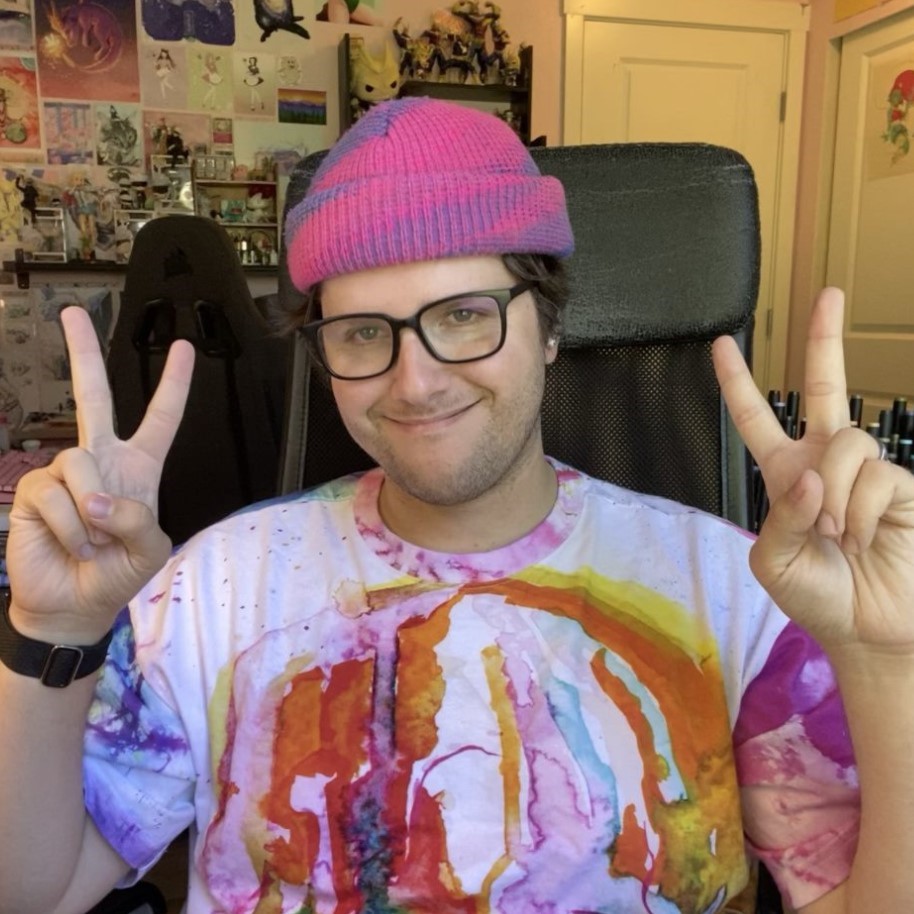 Image of Chris Metzner, Senior Designer on Funko's concept art team. Chris sits in front of his anime collection and holds up a peace sign with both hands.